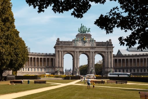 a large building with a statue on top of it. a large building with a statue on top of it.