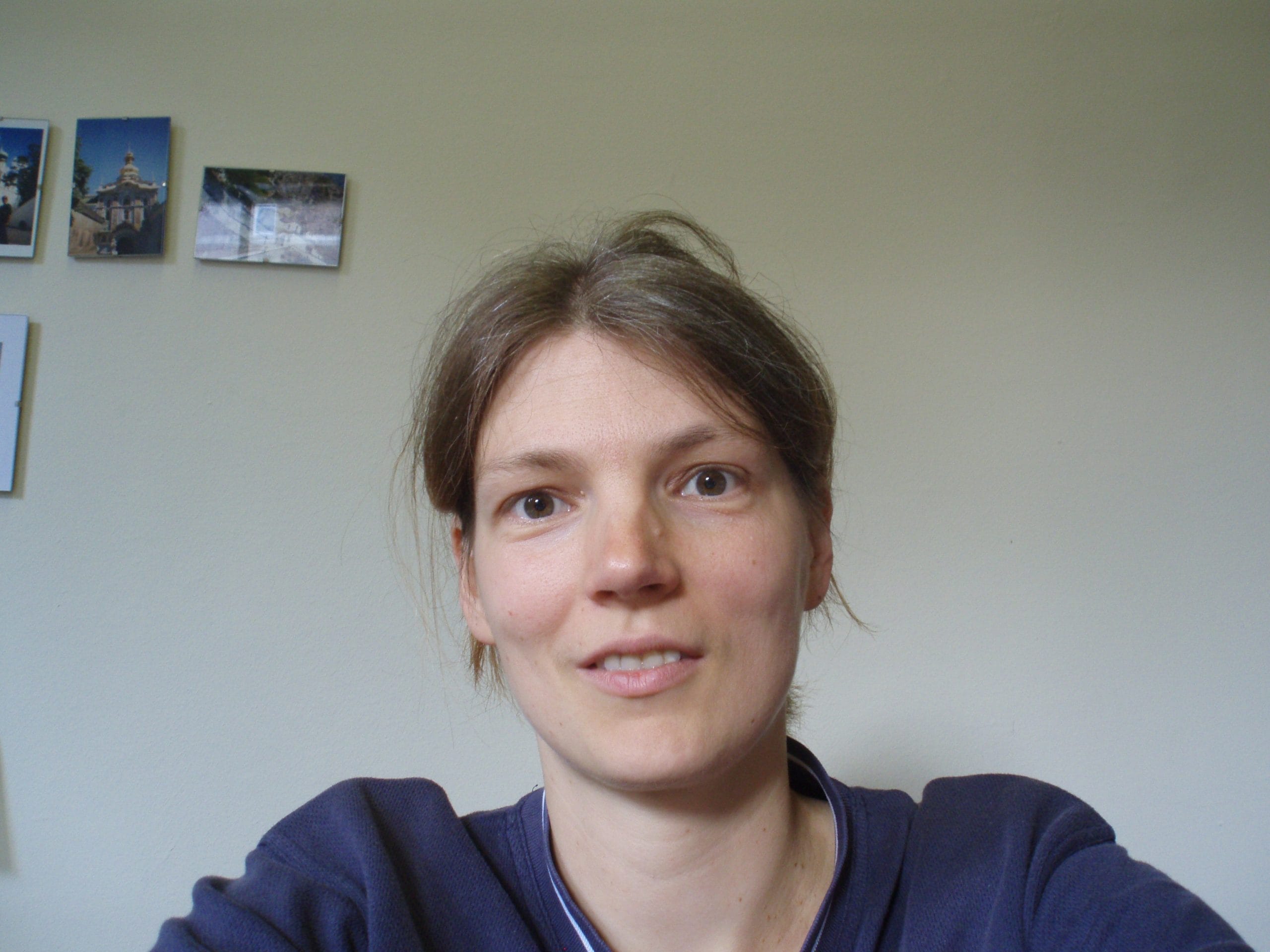 A woman wearing a blue sweater.