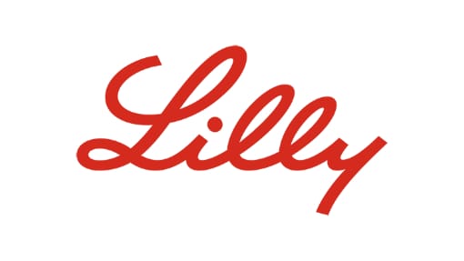Texte cursif rouge épelant "Lilly" sur fond blanc. Red cursive text spelling "Lilly" on a white background.